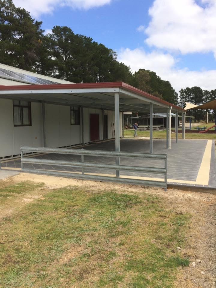 Steel veranda and paved outdoor area at a country property