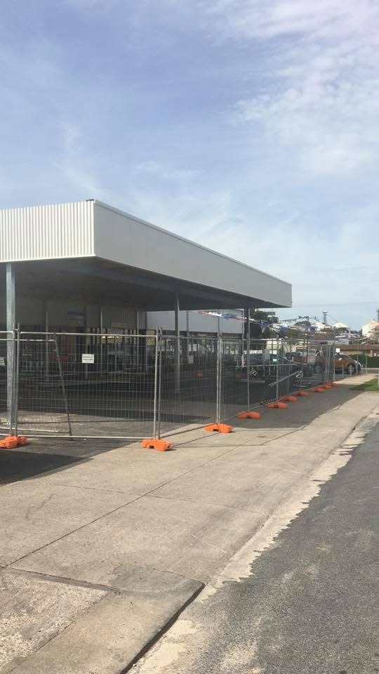 Temporary fence hire setup on a commercial building site